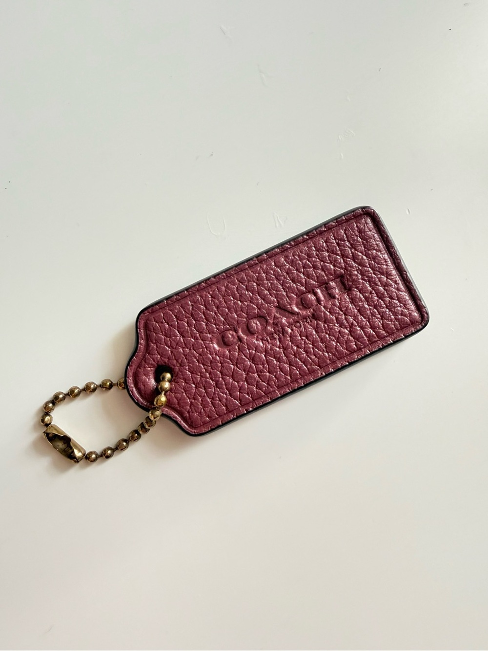Coach Plum Pebbled Leather Hang Tag